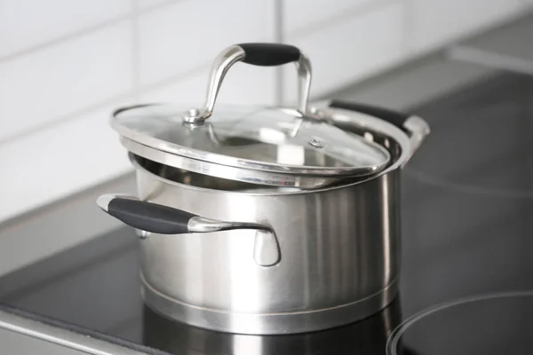 Metal pan on kitchen stove — Stock Photo, Image