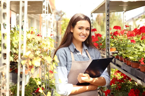 Pretty young florist — Stock Photo, Image