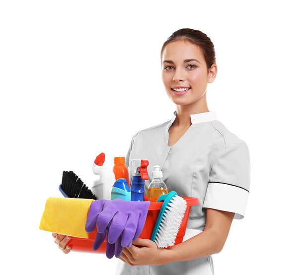 chambermaid holding cleaning supplies
