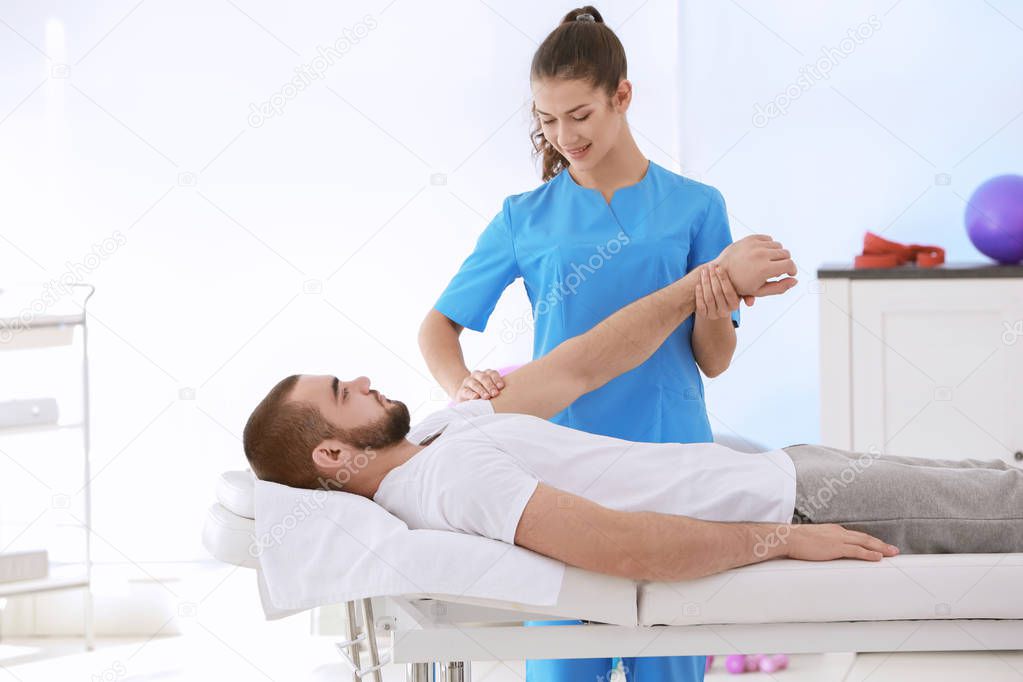 Physiotherapist working with patient 