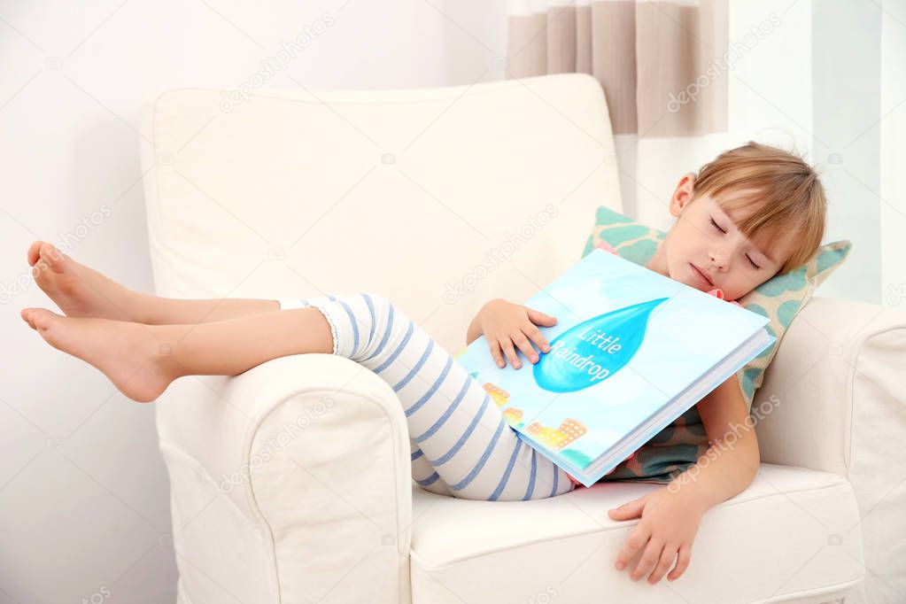 girl sleeping with book