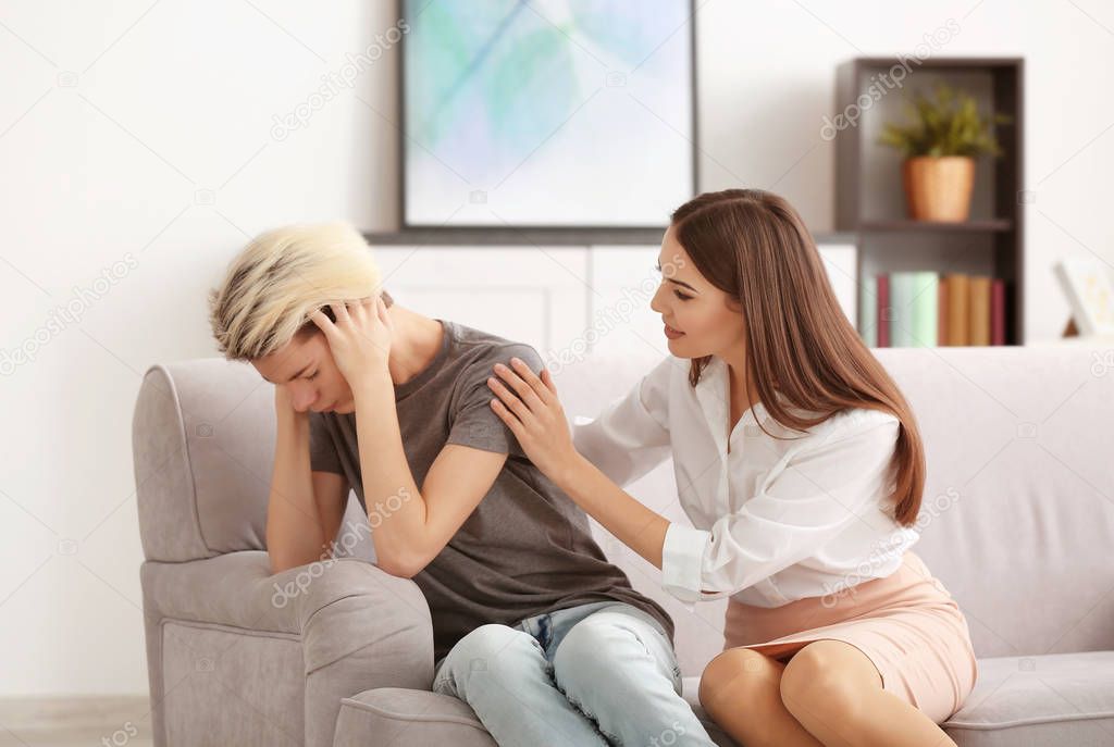 psychologist working with teenager boy