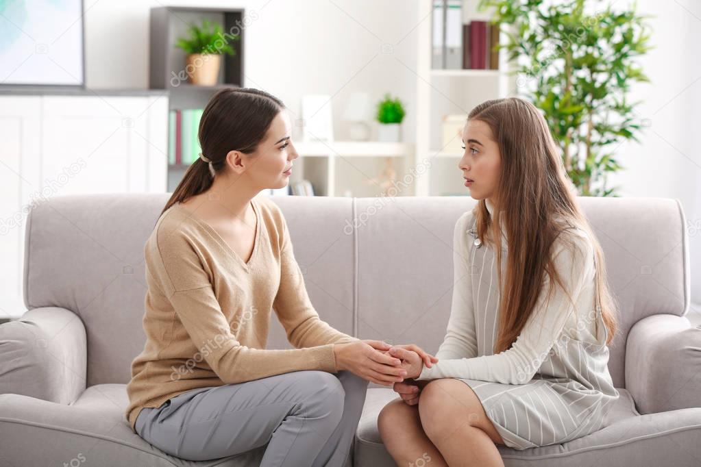 psychologist working with teenager girl