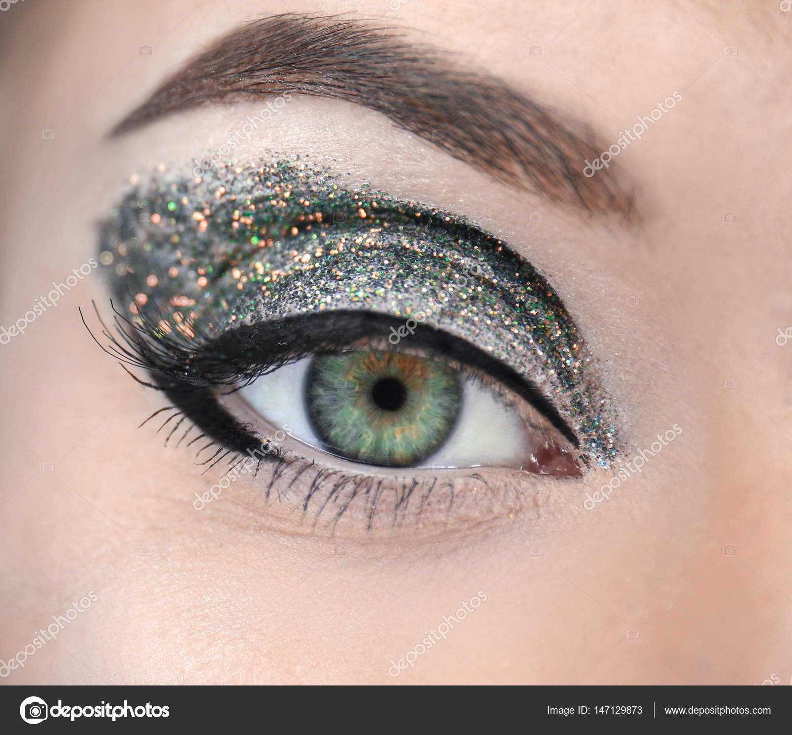 Female eye with fancy makeup Stock Photo by ©belchonock 147129873