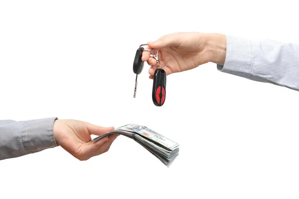 Χέρια που κρατούν τα κλειδιά του αυτοκινήτου και δολάρια — Φωτογραφία Αρχείου