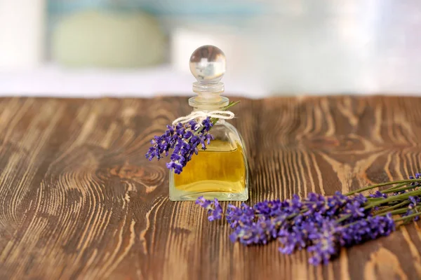 Bottle of essential oil with lavender — Stock Photo, Image