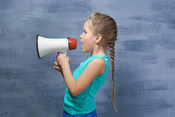 Cute little girl with megaphone — Stock Photo, Image