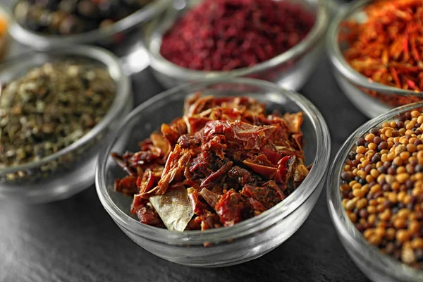 Various spices in glass bowls — Stock Photo, Image