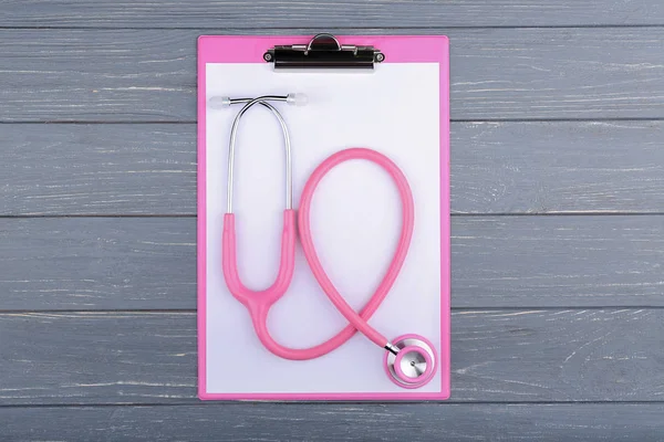 Stethoscope with pink clipboard — Stock Photo, Image