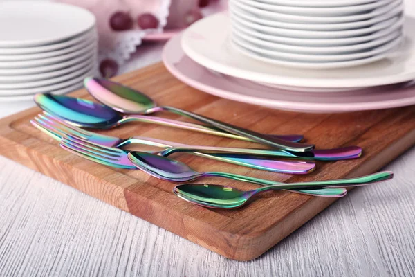 Set of dinnerware on cutting board