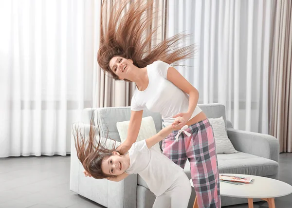 Mother dancing with daughter in the room — Stock Photo, Image