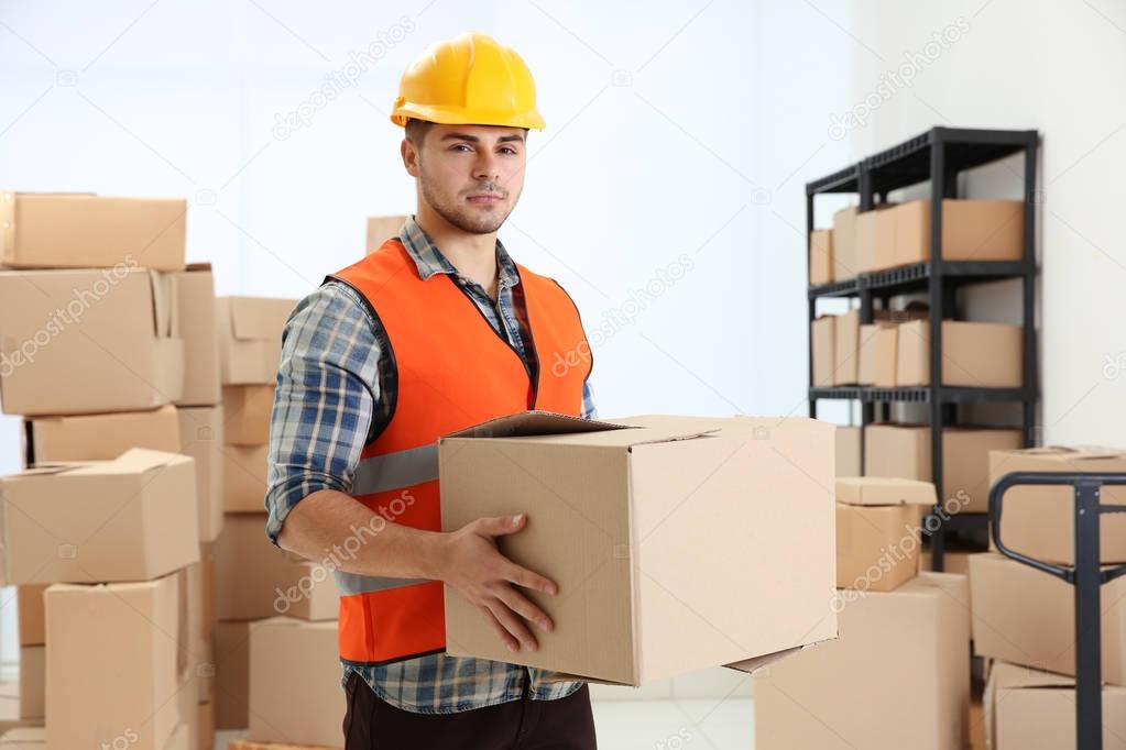 worker holding cartoon box 