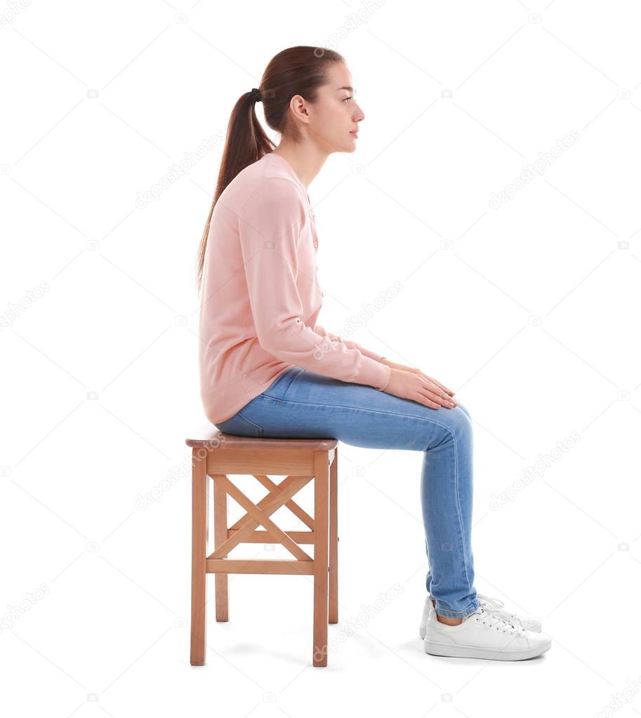 young woman sitting on chair