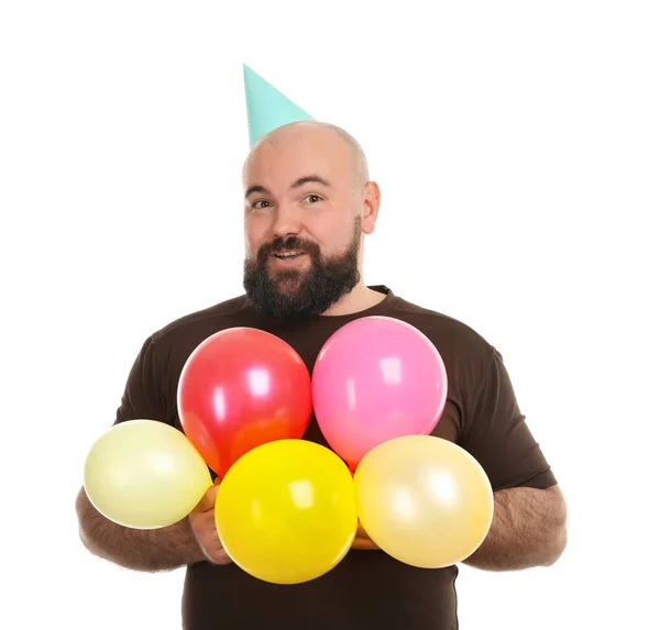 Muž s karnevalovou čepičku a barevné balónky — Stock fotografie