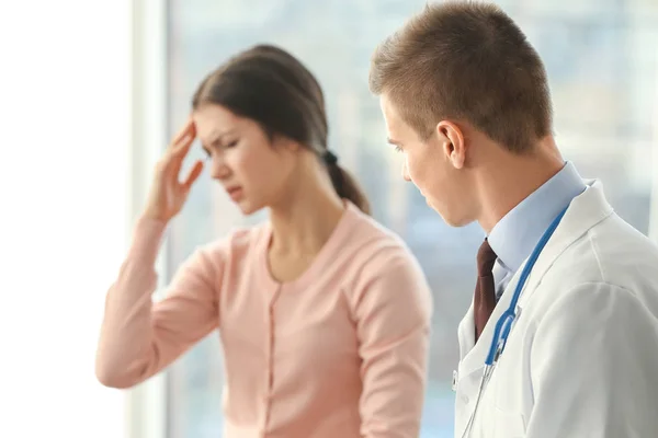 Depressed woman at doctors office — Stock Photo, Image