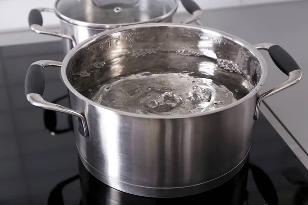 Metal pan with boiling water — Stock Photo, Image