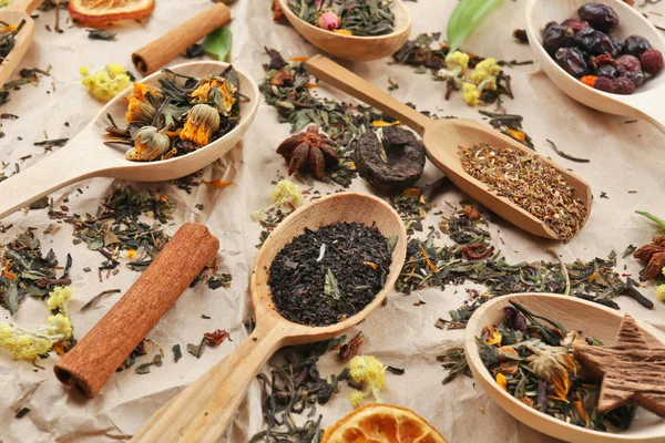 Dried tea in wooden spoons — Stock Photo, Image