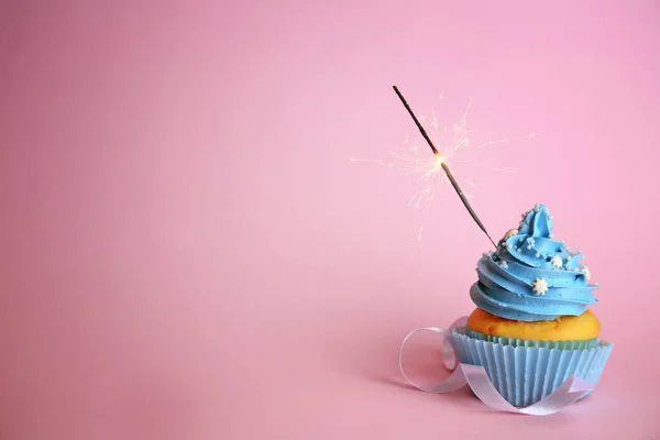 Delicious cupcake with sparkler — Stock Photo, Image