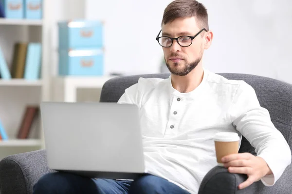 Handsome young programmer working with laptop — Stock Photo, Image
