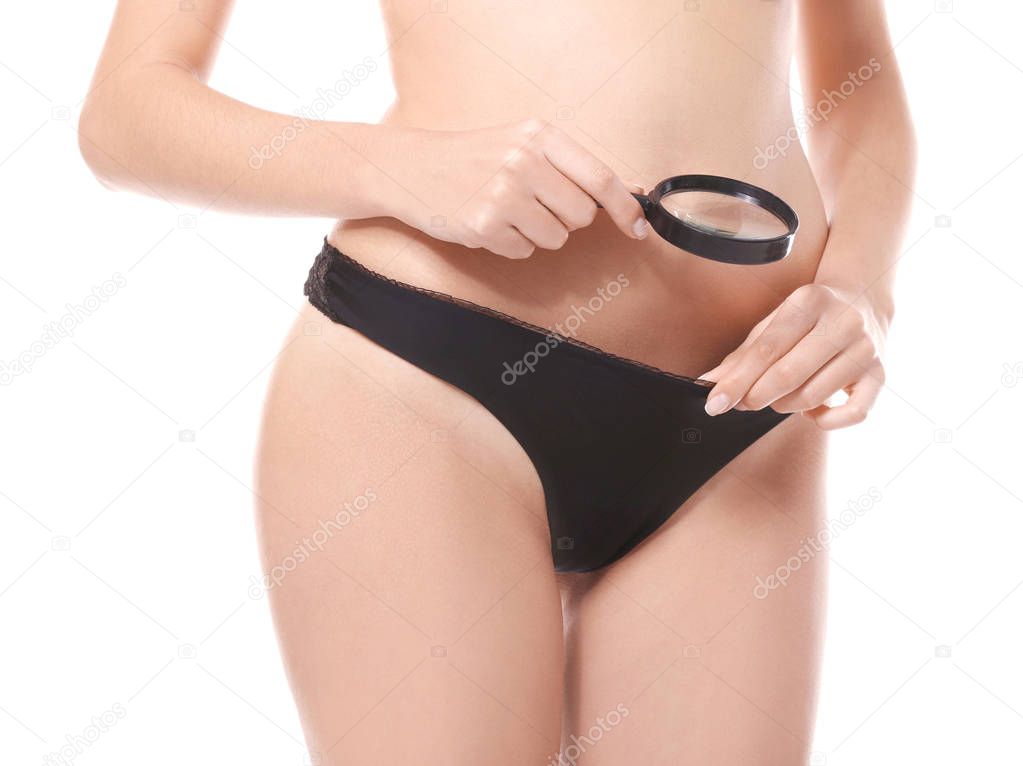 Close up view of young woman with magnifier on white background. Gynecology concept