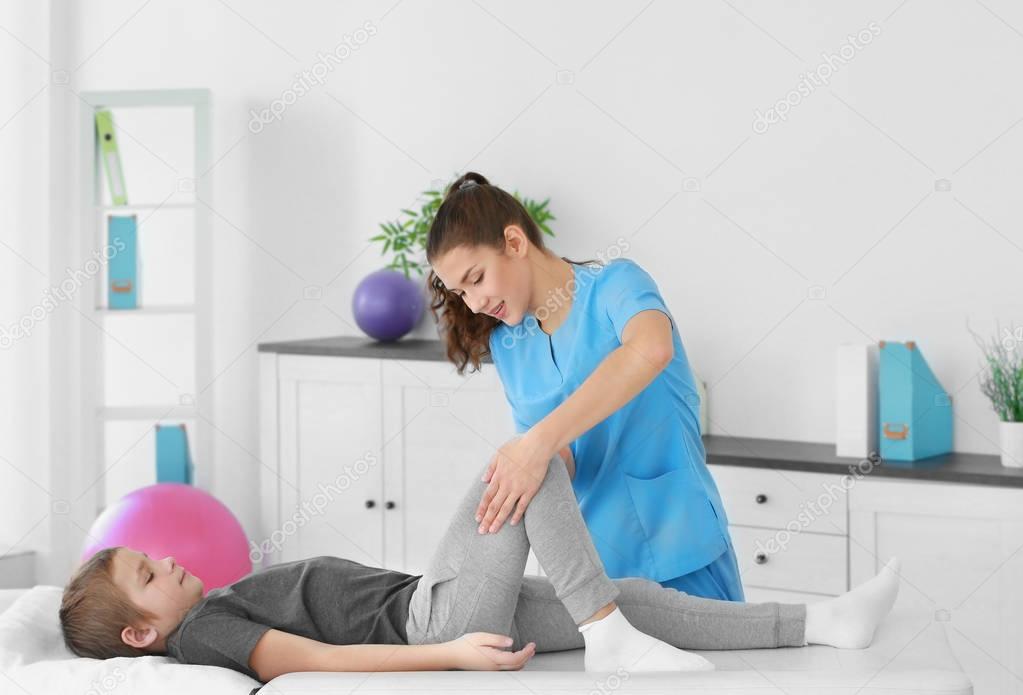 Physiotherapist working with patient in clinic