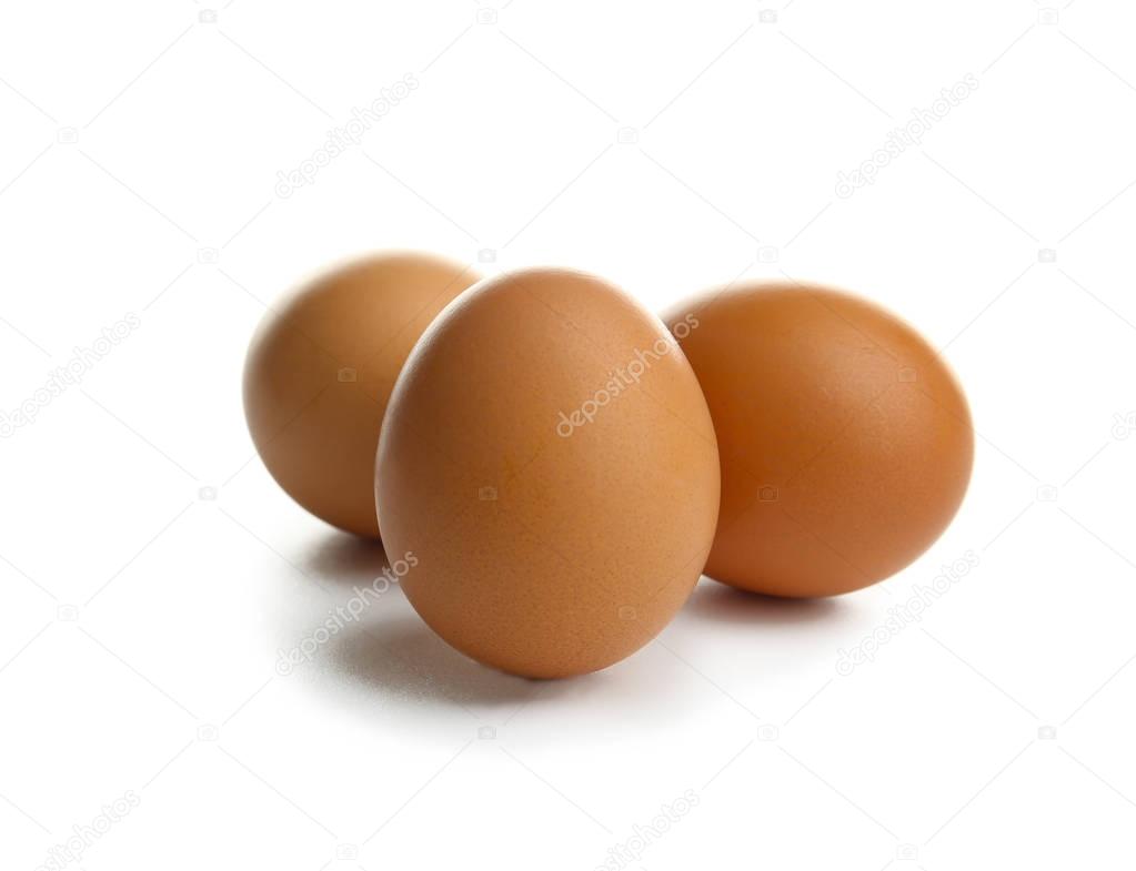 Raw eggs on white background