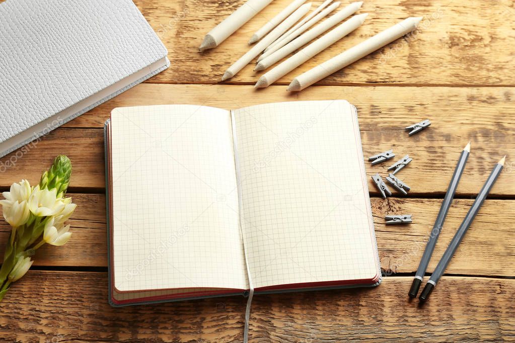 Opened notebook on wooden table — Stock Photo © belchonock 147139627