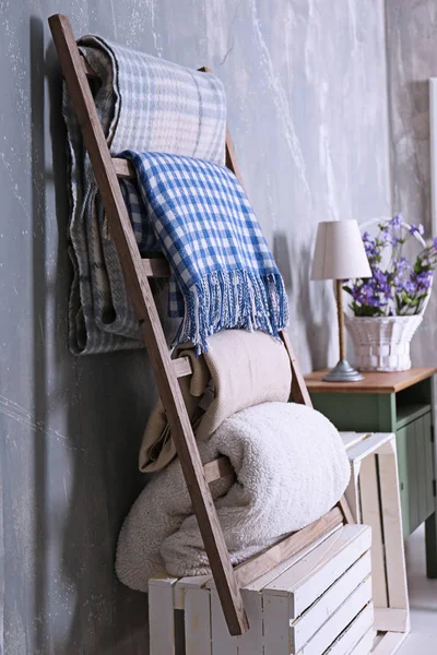 Warm plaids on ladder — Stock Photo, Image