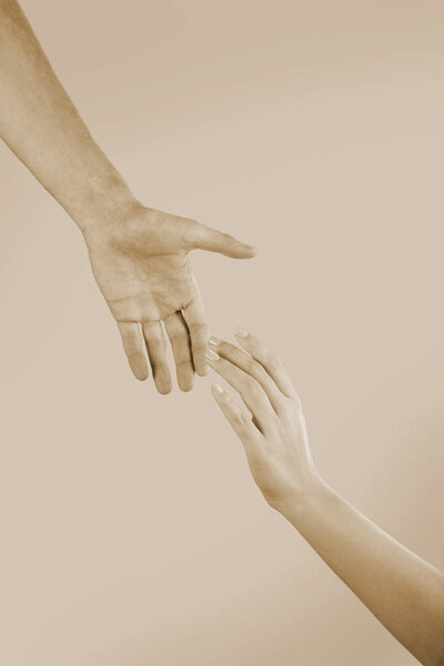 Male and female hands touching