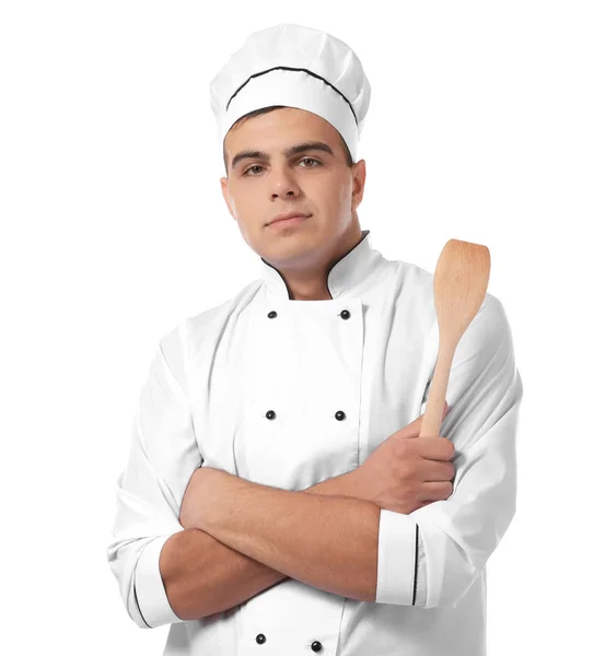 Молодий красивий шеф-кухар готує з шпателем ізольовано на білому — стокове фото