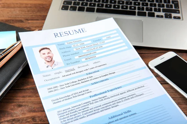 Resume on wooden table — Stock Photo, Image