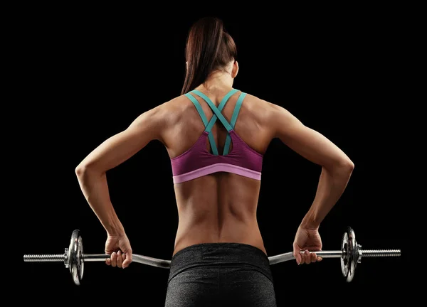 Sporty young woman with barbell — Stock Photo, Image