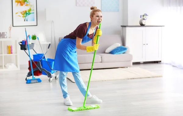 Funny woman with mop — Stock Photo, Image