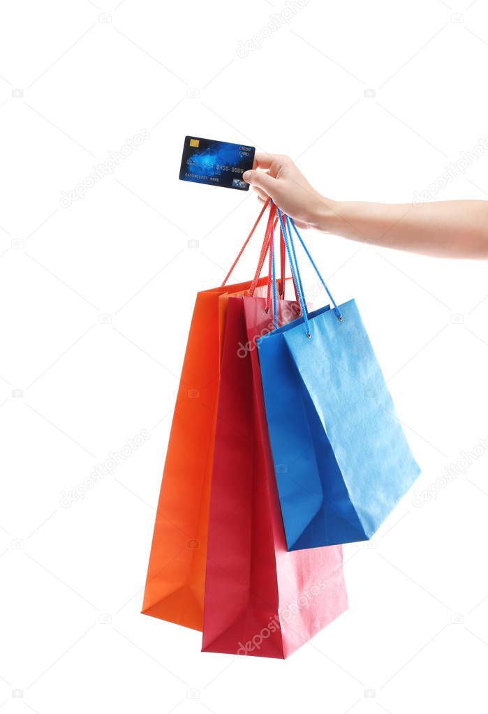 Woman with shopping bags and credit card