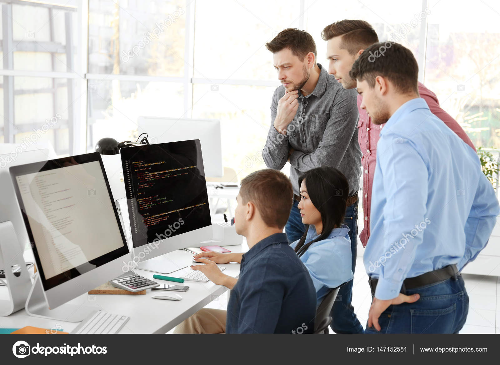 Young programmers working in office Stock Photo by Â©belchonock ...