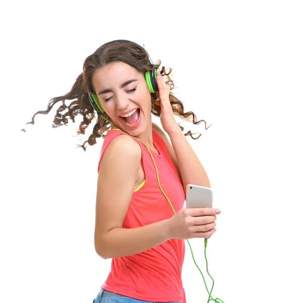 戴耳机听音乐的年轻妇女 — 图库照片