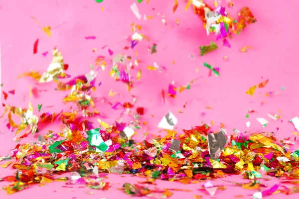 Colorful confetti on color background — Stock Photo, Image