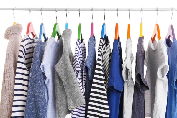 Hangers with different clothes — Stock Photo, Image