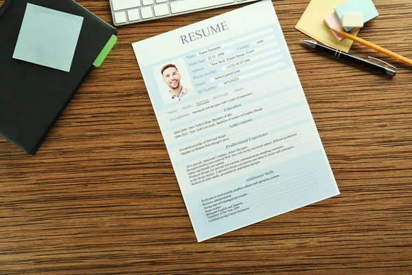 Closeup of resume file on wooden table — Stock Photo, Image