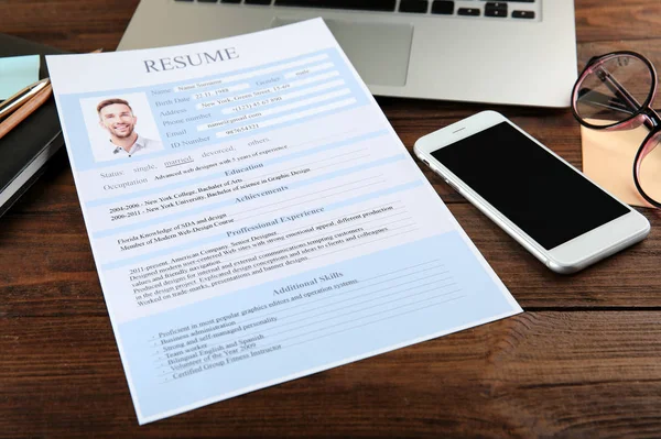 Resume on wooden table — Stock Photo, Image