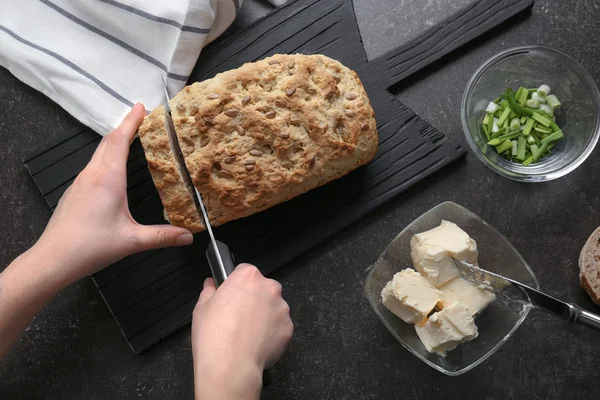 Woman cutting beer bread