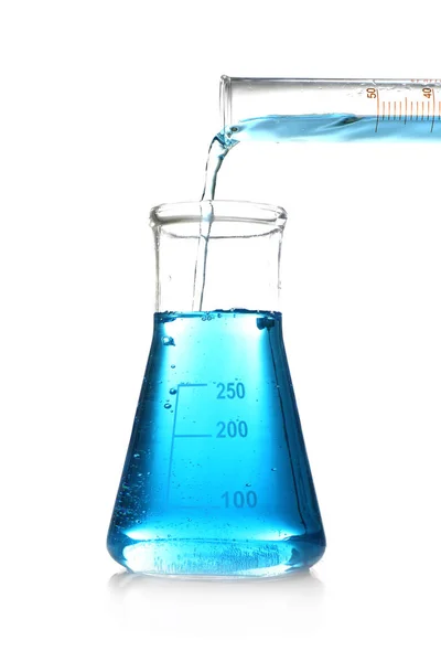 Pouring blue sample into test flask — Stock Photo, Image