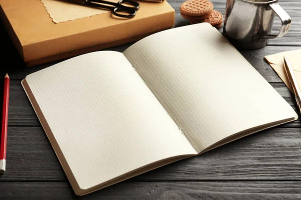 Opened notebook on  table — Stock Photo, Image