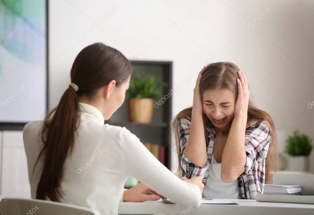 psychologist working with teenager girl
