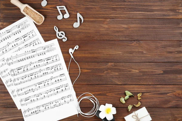 Composition of music sheets and spa supplies