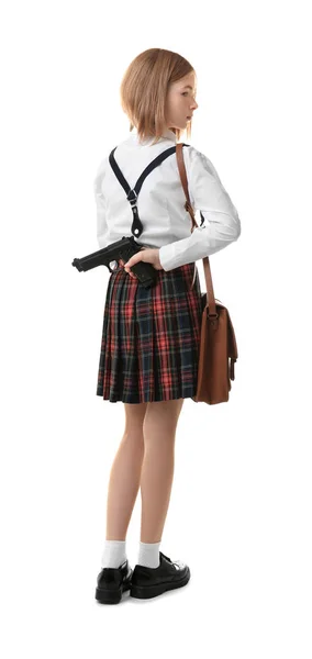 Schoolgirl hiding gun behind her back — Stock Photo, Image