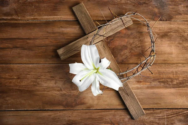 Lily and crown of thorns and cross — Stock Photo, Image