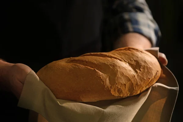 Male hands with loaf of bread — Stock Photo, Image