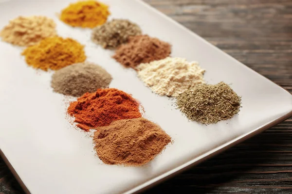 Plate with different spices, closeup — Stock Photo, Image