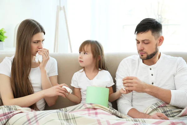 Ill family on sofa — Stock Photo, Image